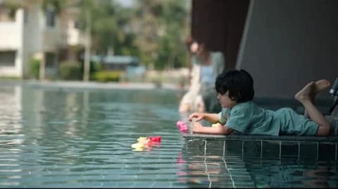 Kid enjoying the pool of manu maharani resort